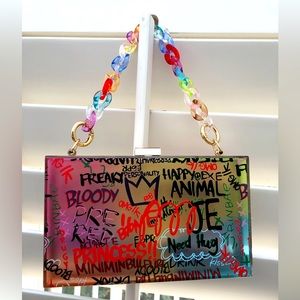 Niknyce Official graffiti print clear acrylic clutch purse. NWOT